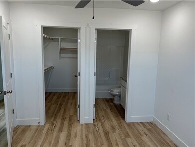 Master bedroom view of closet and bathroom