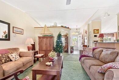 This view of the living room while standing in front of the wood stove.