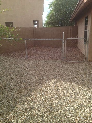 gated dog area on side yard