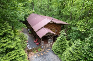 Aerial view of property and surrounding area with 