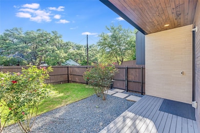 Deck with a fenced backyard