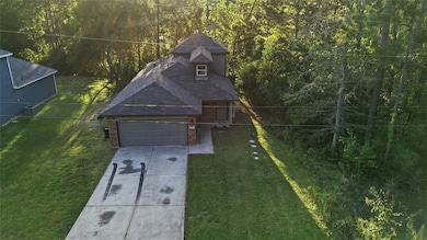 15082 Arrowhead Loop E, Willis, TX 77378 - photo 3