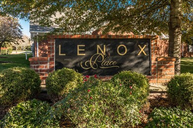 Gorgeous Brick and Stone accent condominium nestled in the 55 and Better Community of Lenox Place. 