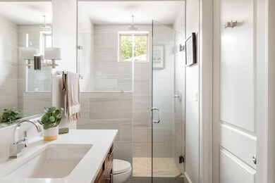 Bathroom with vanity and a stall shower