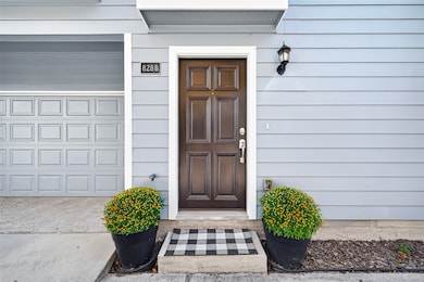 828B is one of six homes in a small community with no HOA. The exterior of the home is cement/hardi board (with no stucco) and was painted in 2024.