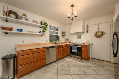 Eat-in kitchen with tile floors and new countertops