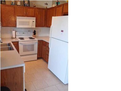 Tiled floors in the kitchen and updated cabinet ha
