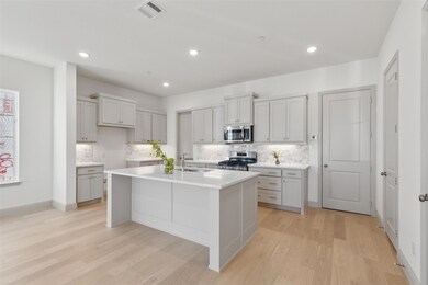 The spacious kitchen island is the perfect gatheri