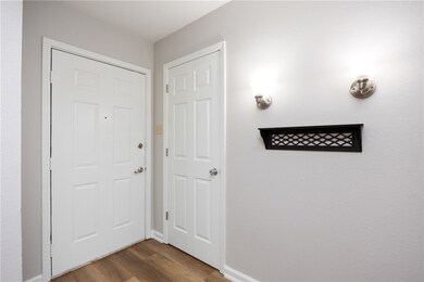 Front entrance with a storage closet to the left o