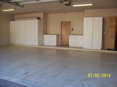 3 Car Garage with Storage Cabinets