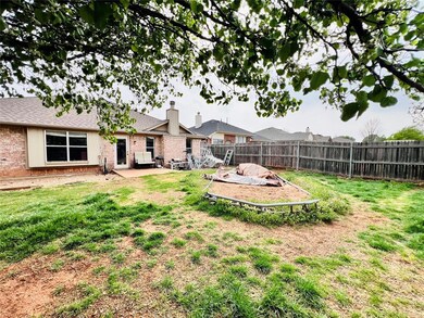 View of yard featuring a fenced backyard and a pat