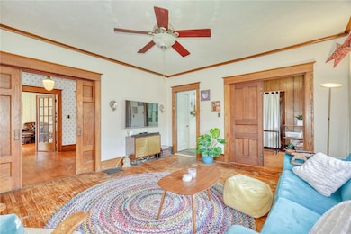 Family Family Room with hardwood floors, wood trim