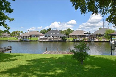 TREE SHADED YARD OVERLOOKING NAVIGABLE WATER WAY