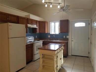 Ample kitchen, with food prep island, vaulted ceilings, lots of cabinet space!