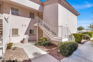 Property entrance with stucco siding, a tiled roof