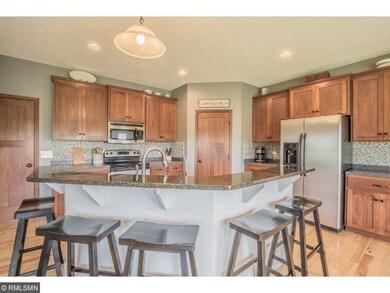 Kitchen features stainless steel appliances, drama