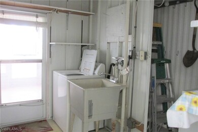 Laundry/utility w/door on left to rear lanai.
