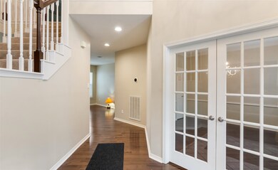 When you enter the home to the right is the formal dining with french doors.