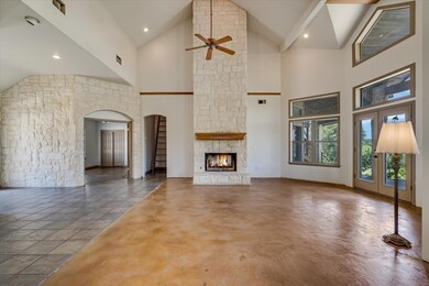 Unfurnished living room with a ceiling fan, a sto