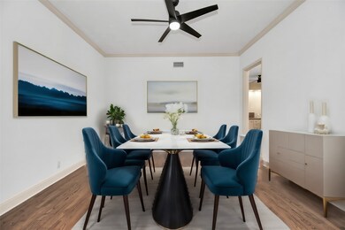 Entertain in style and grace in a formal dining room seamlessly connected to the kitchen and living area