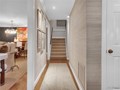 Foyer with grasscloth wallpaper.