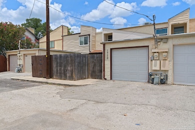 Garage door with fence/gate entrance to left