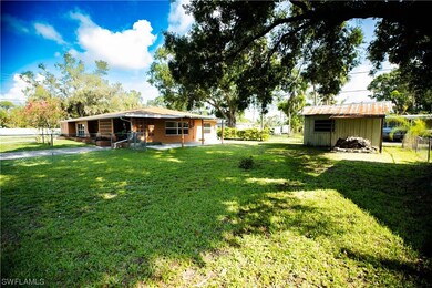 Extra large fenced yard with storage shed/workshop