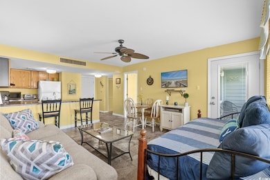Living room featuring a toaster, visible vents, ba
