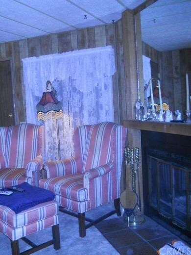Sitting area next to the wood burning fireplace. V