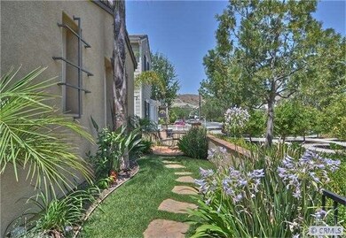 Grass and Garden view of the Front Yard which lead