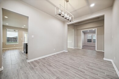 This is a spacious Dining Room features wood-look