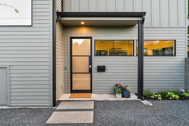 Doorway to property with board and batten siding