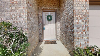 29022 Jacobs River Dr, Katy, TX 77494, Front entry porch, surrounded with brick walls, and wooden door painted in a tan color for warm look.