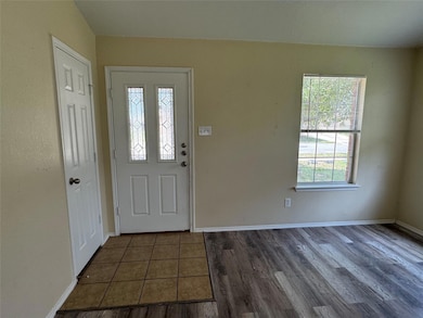 Entryway with plenty of natural light, baseboards