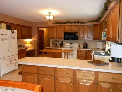 Plenty of countertops and cabinets! Built in desk.