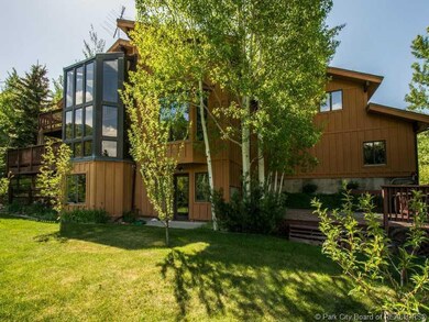 Exterior Back. Flat grassed fenced yard