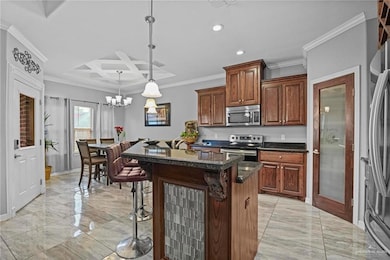 Kitchen featuring appliances with stainless steel finishes, light marble finish floors, a breakfast bar area, recessed lighting, and coffered ceiling