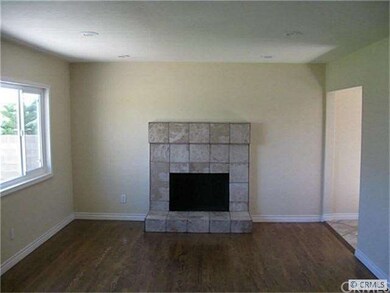 Living Room with hardwood floors and fireplace. Re