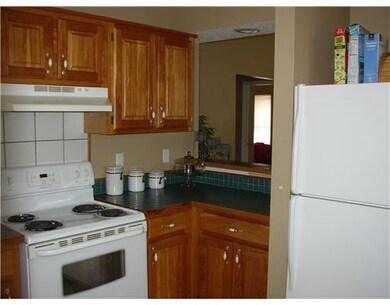 Kitchen. Another view of kitchen shows pas through