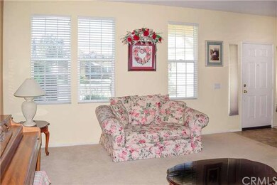 Spacious formal living room with lots of natural l