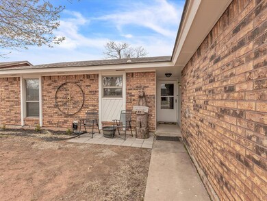 View of exterior entry featuring a patio area