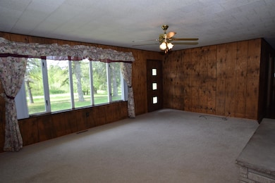 Spacious Living room with a spectacular view of the front yard. This room will be everyone's favorite gathering spot with the windows and the cozy fireplace.