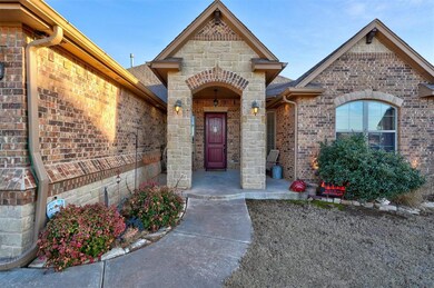 Property entrance featuring brick siding