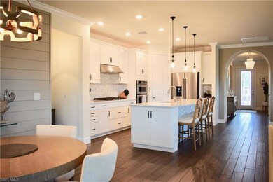 Kitchen featuring built in appliances