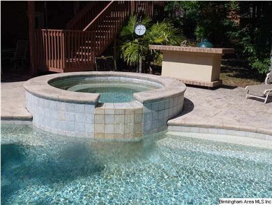 WATERFALL FROM SPA INTO HEATED POOL.