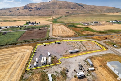 Overview of rural landscape featuring mountains and property parcel outlined