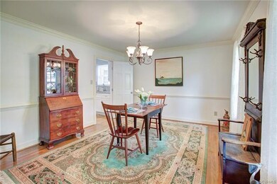 Dining Room/Office with chandelier, hardwood floor