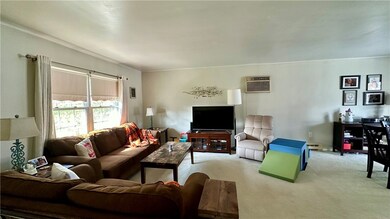 SPACIOUS LIVING ROOM WITH PLENTY OF NATURAL SUNLIG