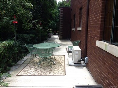 rear of home with concrete patio