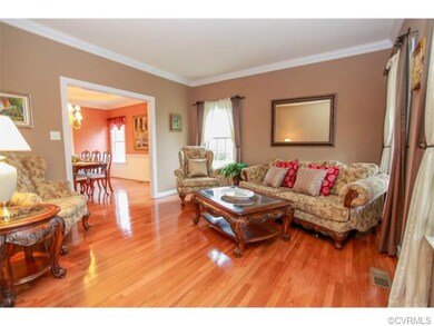 The living room has a wide entrance to the dining 
